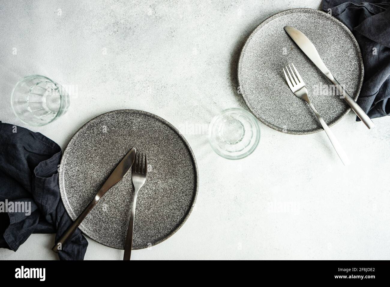 Overhead view of two minimalistic place settings on a  table Stock Photo