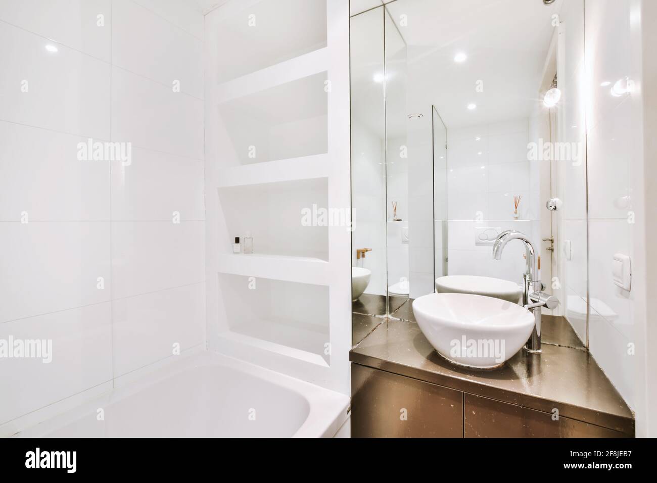 Interior of modern bathroom with bathtub and mirror Stock Photo Alamy