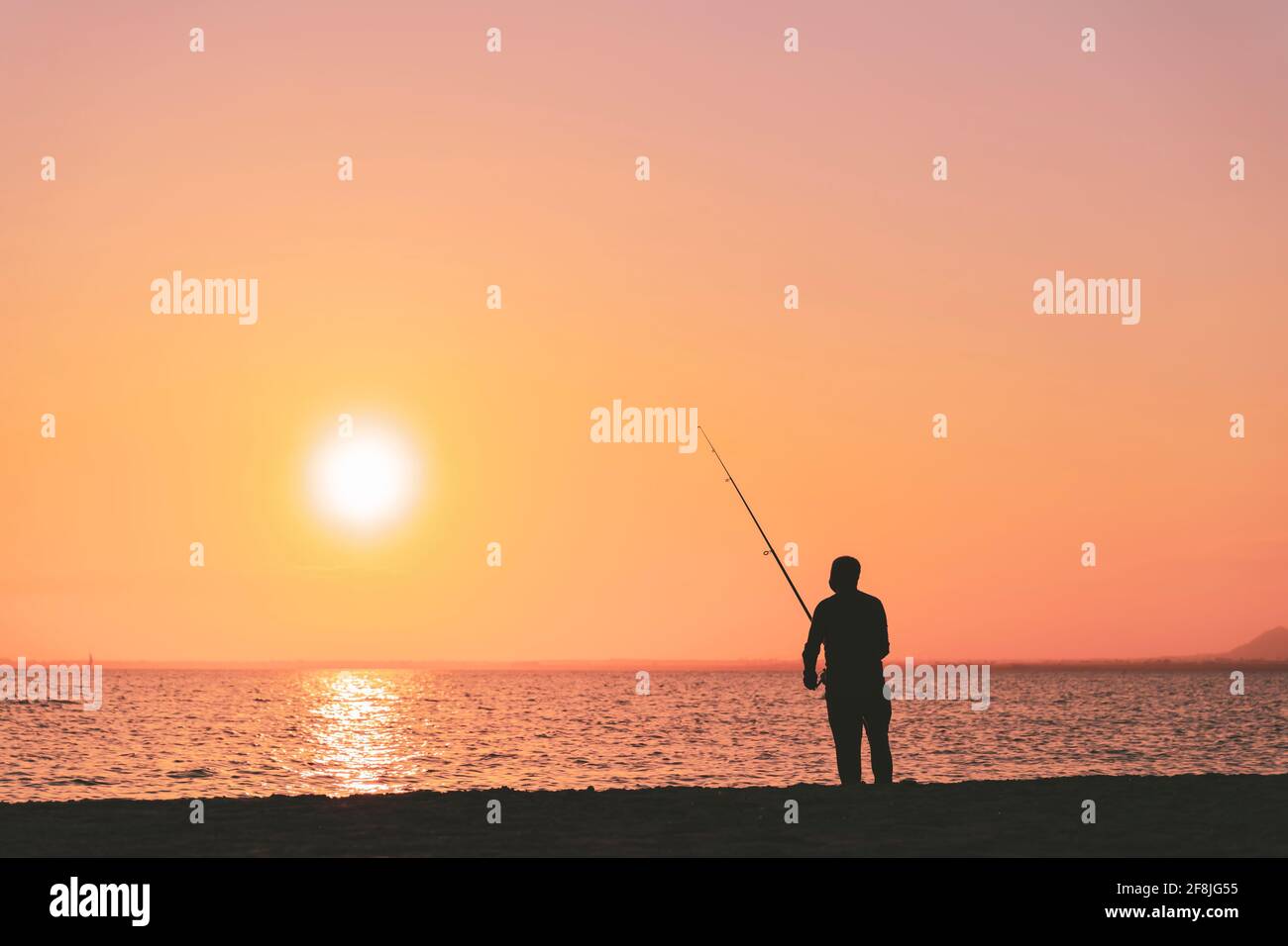 Silhouette of man fishing hi-res stock photography and images - Alamy