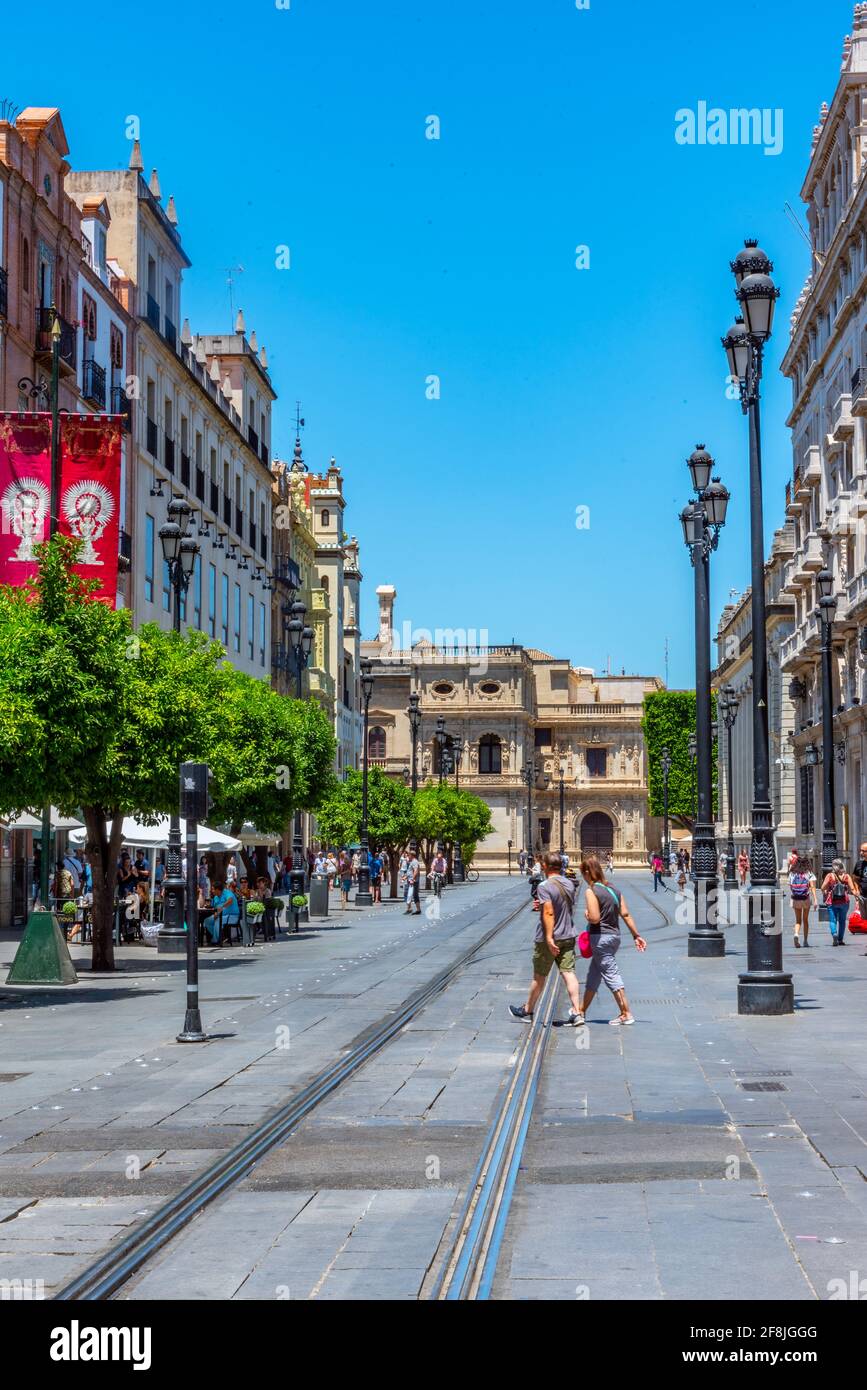 SEVILLA, SPAIN, JUNE 25, 2019: People are strolling on avenida de la constitucion in Sevilla, Spain Stock Photo