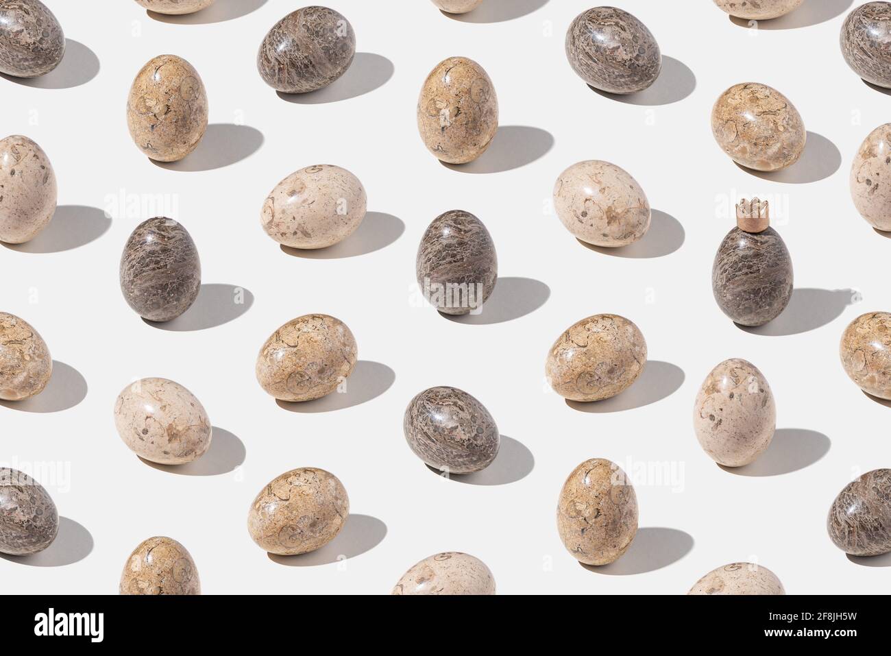 Pattern with decorated easter eggs on light gray background. Min Stock Photo