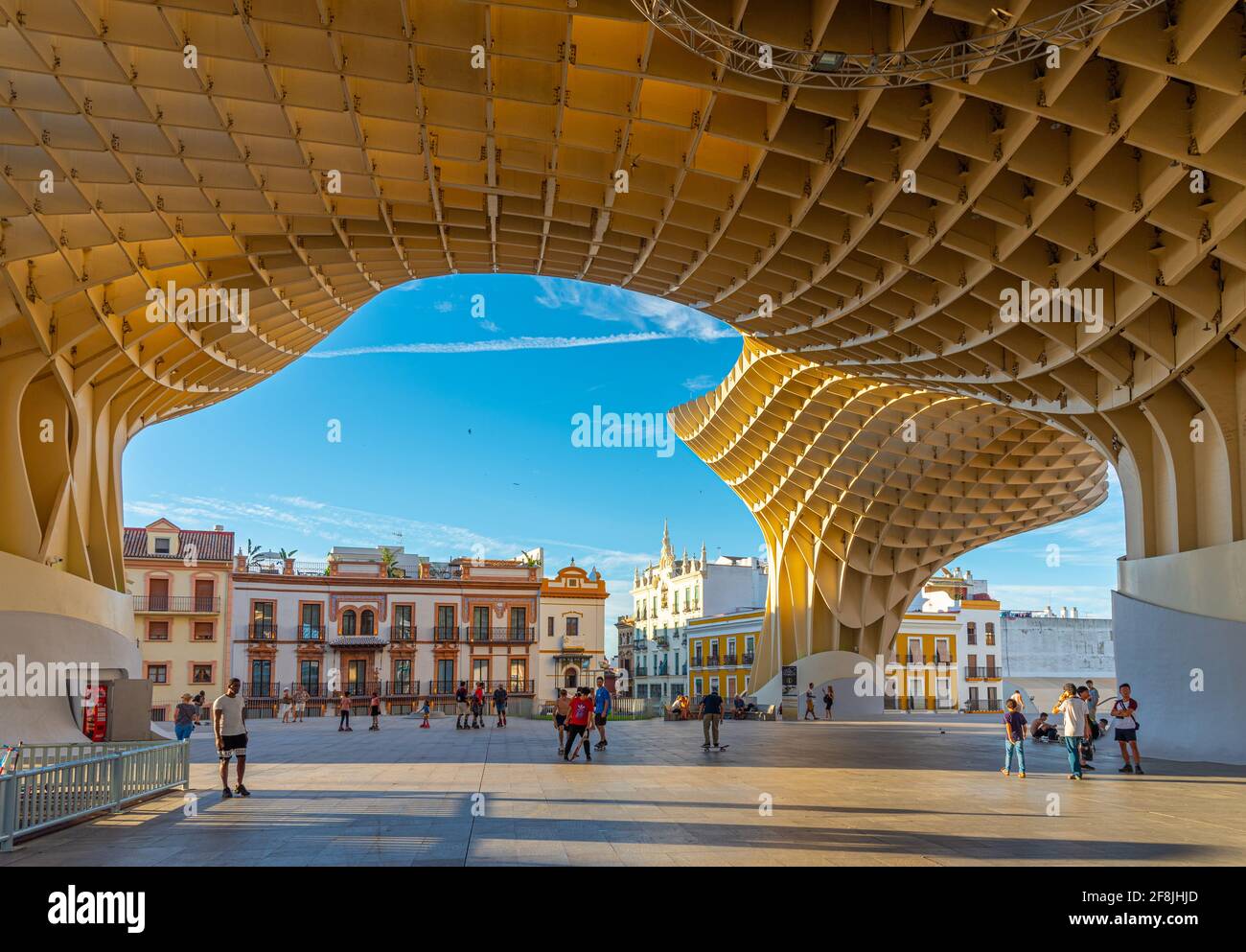 SEVILLA, SPAIN, JUNE 24, 2019: People are strolling through pillars of Setas de Sevilla in Spain Stock Photo