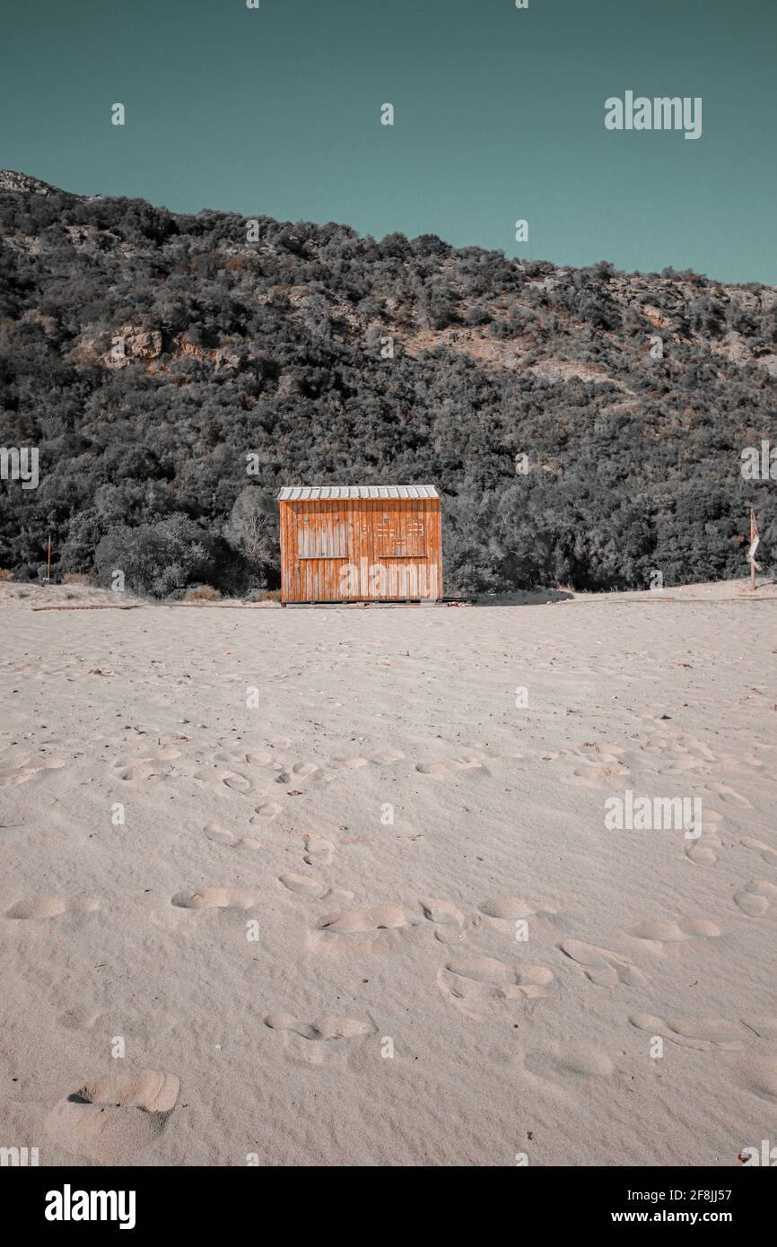 Wooden yellow hut on the beach Stock Photo