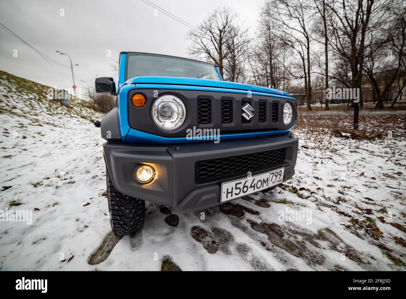 Moscow, Russia - January 24, 2020: Front optics of the new mini SUV Suzuki Jimny Static Photos in winter forest. close-up Stock Photo