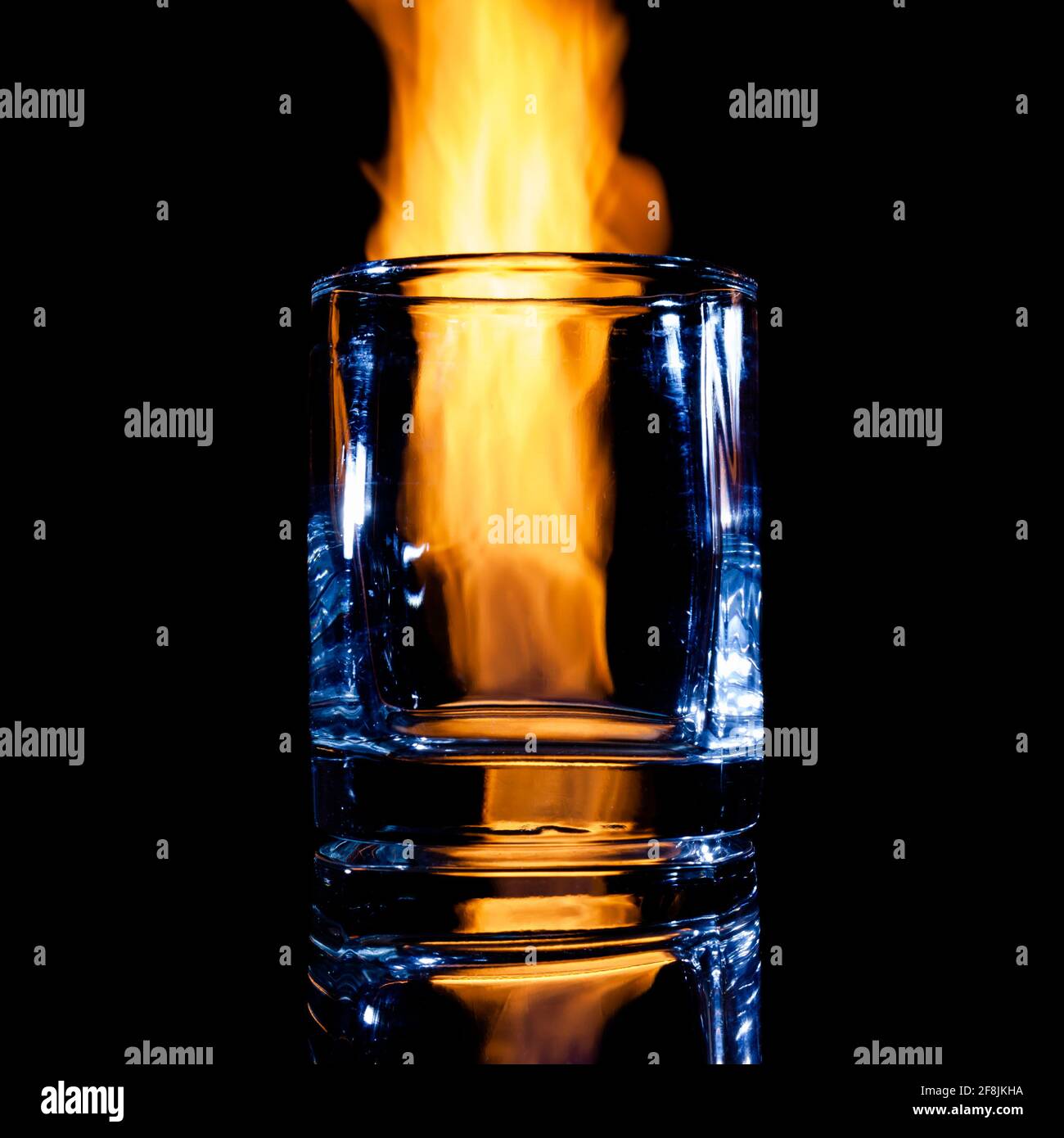 burning glass on a black background, isolate Stock Photo