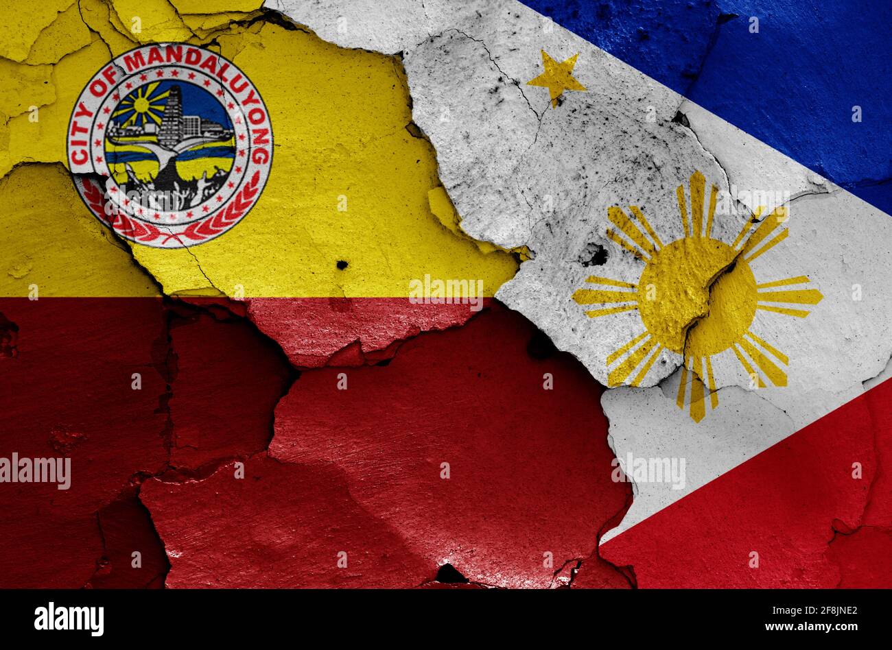 flags of Mandaluyong and Philippines painted on cracked wall Stock Photo