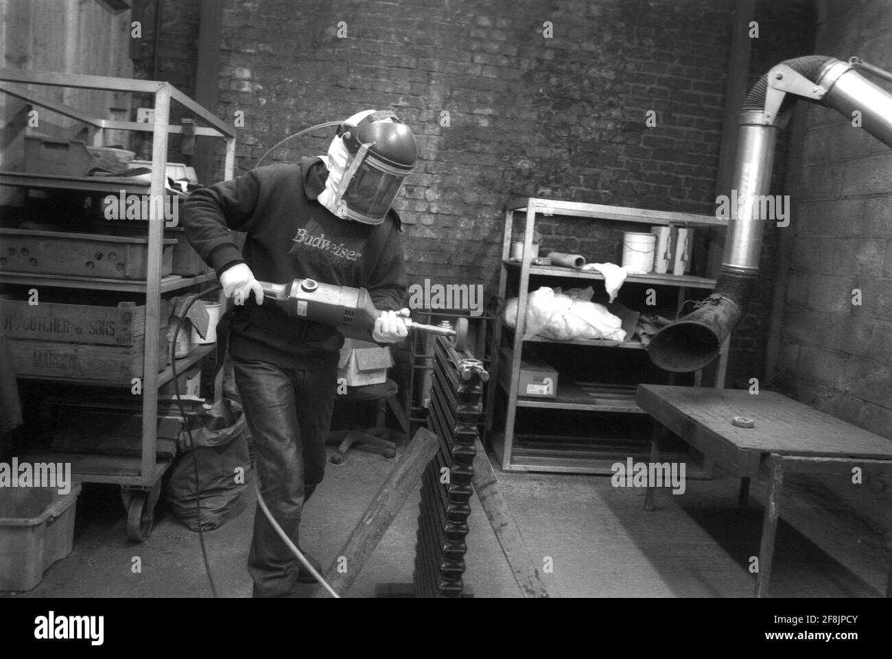 Sandblasting Radiators High Pressure Washer Sand Blasting a radiator in an enclosed workshop ...
