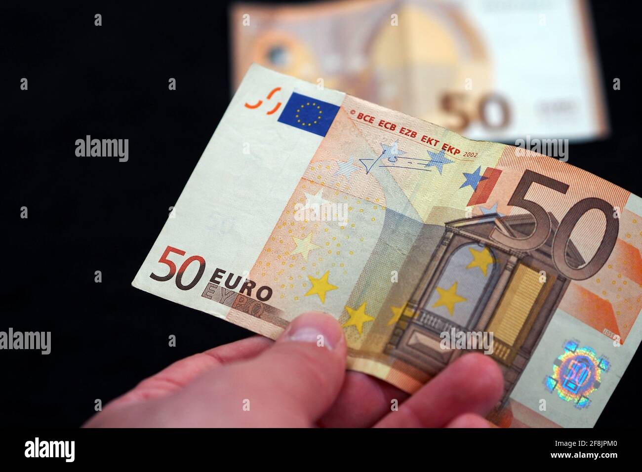 new and old 50 euro banknotes stand on black background Stock Photo - Alamy