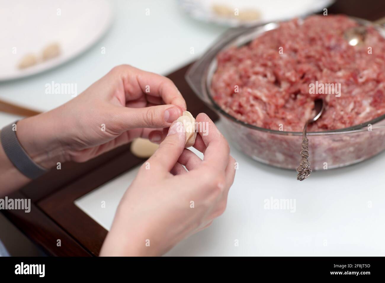 The cook is making pelmeni at home Stock Photo