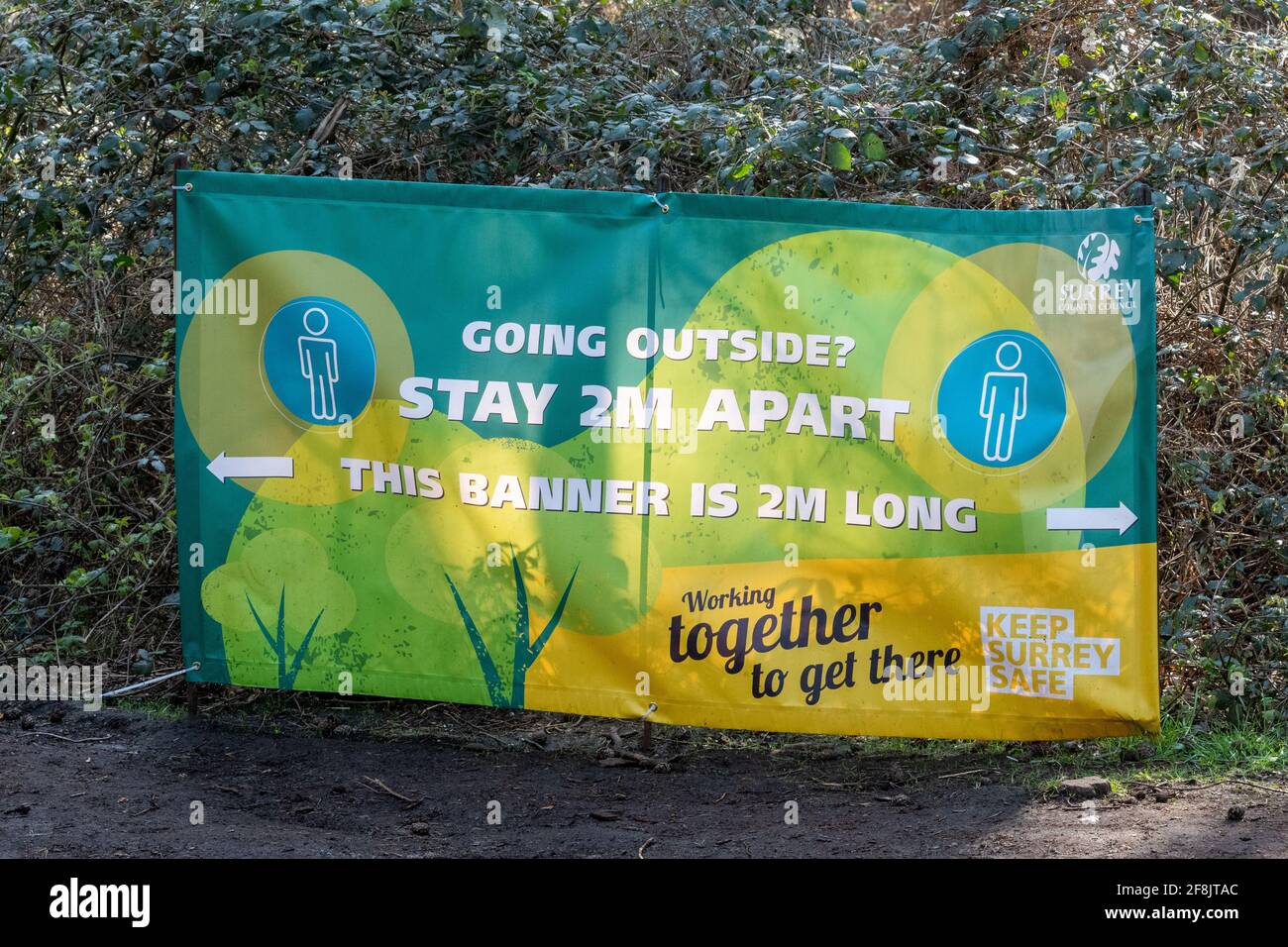 Stay 2 metres apart advice on banner in the countryside during the covid-19 coronavirus pandemic, UK, 2021 Stock Photo