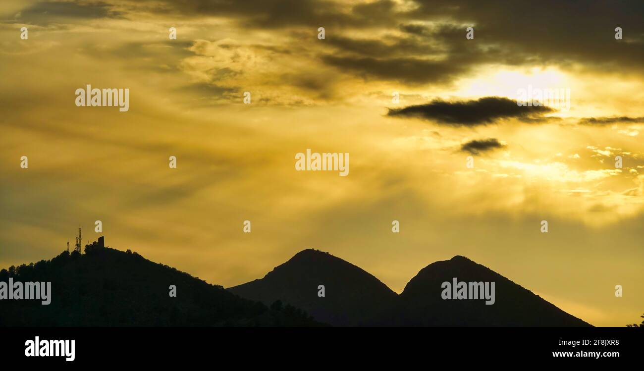 Warm sunset over the mountains Stock Photo - Alamy
