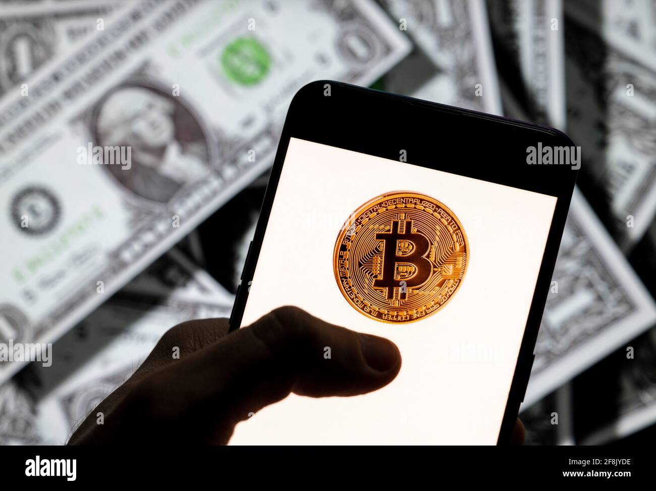 In this photo illustration, the cryptocurrency electronic cash Bitcoin (BTC,  BCH) logo is seen on an Android mobile device screen with the currency of  the United States dollar icon, $ icon symbol