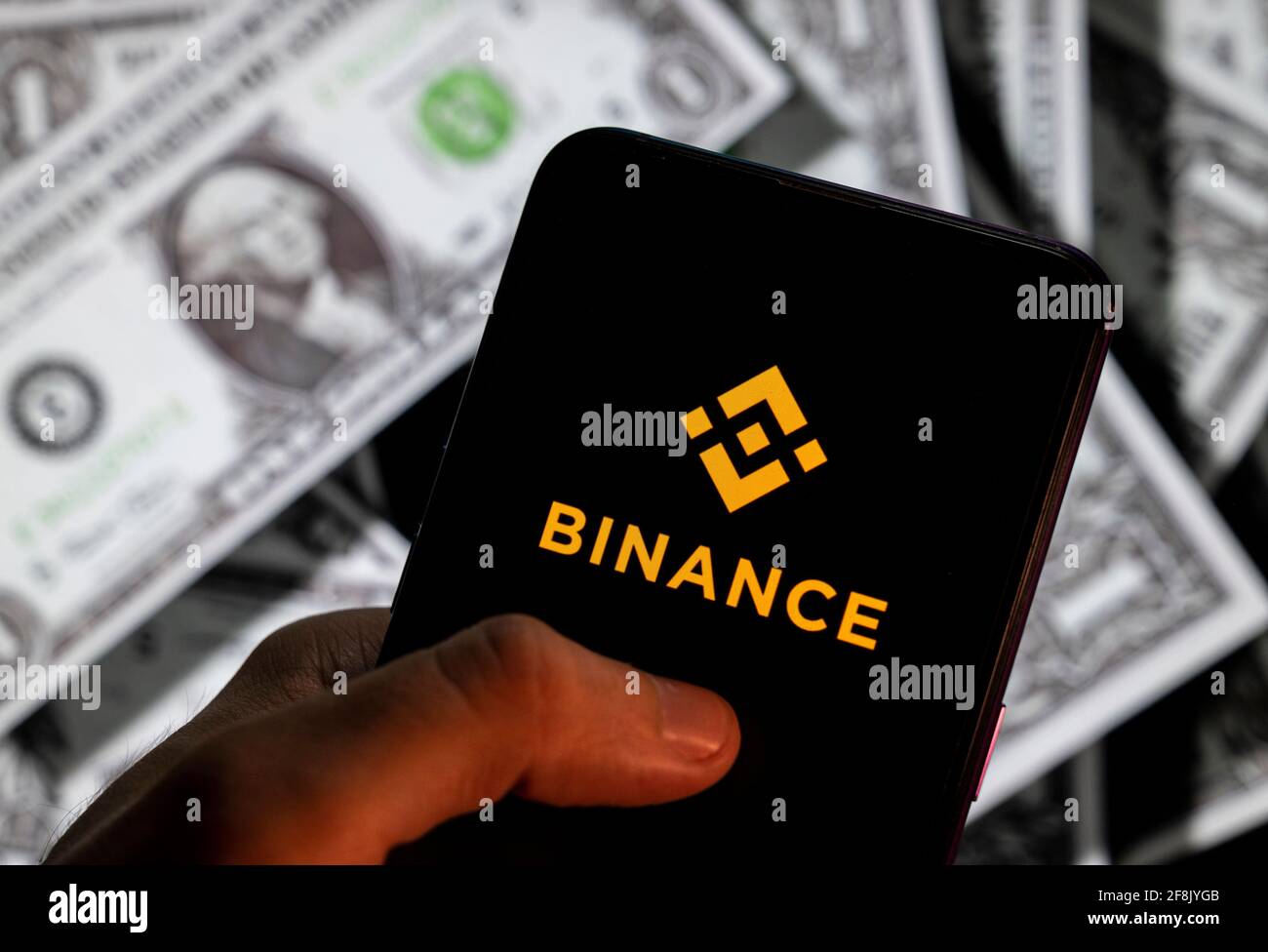 In this photo illustration, the cryptocurrency exchange trading platform  Binance logo is seen on an Android mobile device screen with the currency of  the United States dollar icon, $ icon symbol in
