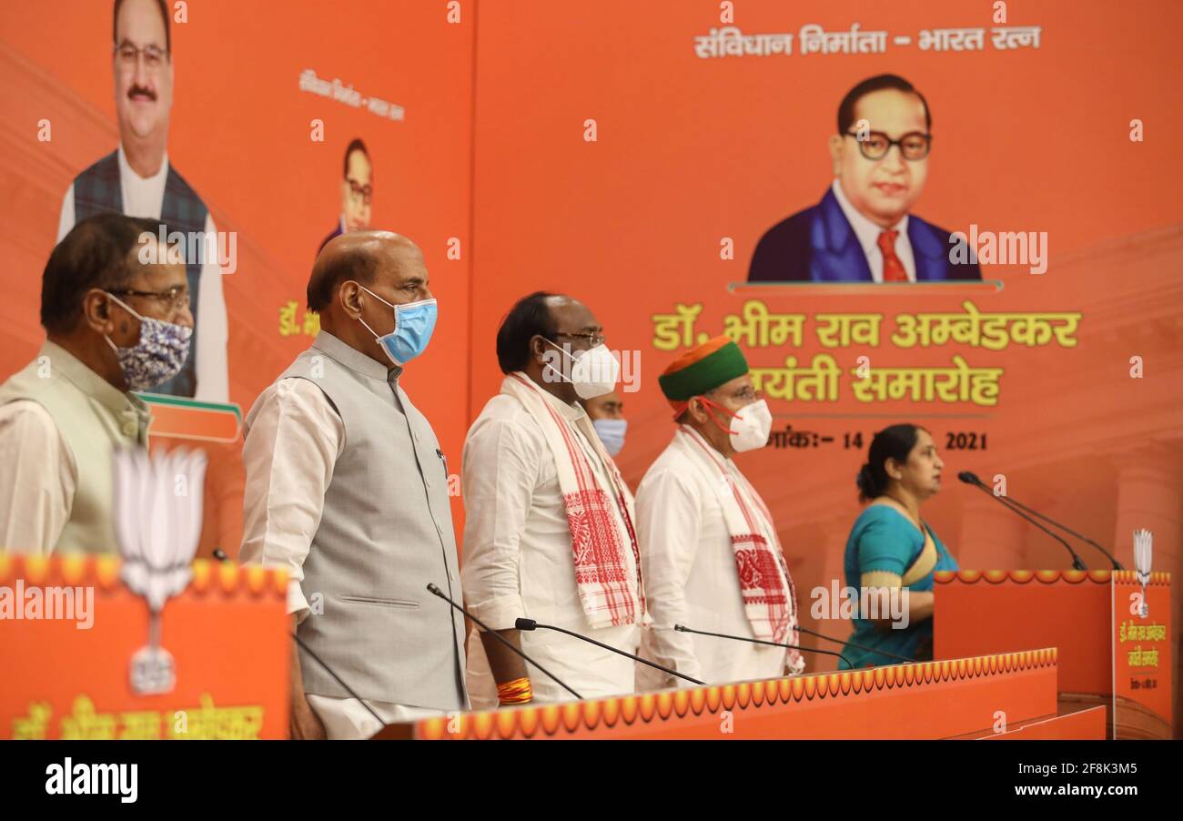 New Delhi, India. 14th Apr, 2021. Indian Defence Minister, Rajnath Singh and BJP party workers attend an event in honour of Bharat Ratna Baba Sahab Bhim Rao Ambedkar's birth anniversary, at BJP party headquarter in New Delhi. The nation is celebrating the 130th birth anniversary of Dr. B.R. Ambedkar, the architect of Indian Constitution. He campaigned against social discrimination towards the untouchables (Dalits), all his life he worked for the welfare of the poor. Credit: SOPA Images Limited/Alamy Live News Stock Photo