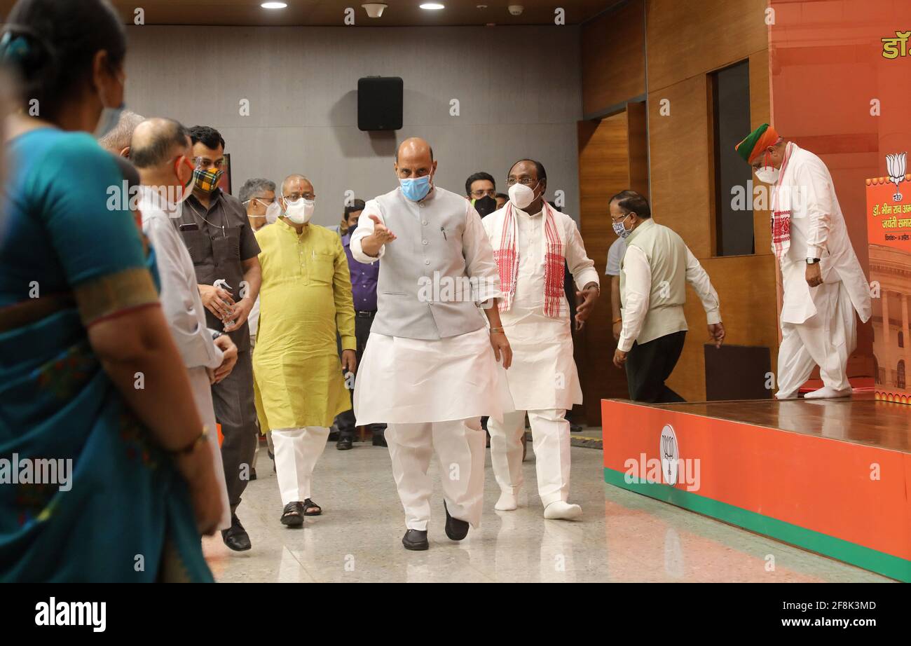 New Delhi, India. 14th Apr, 2021. Indian Defense Minister, Rajnath Singh wearing face mask arrives at an event in honour of Bharat Ratna Baba Sahab Bhim Rao Ambedkar's birth anniversary, at BJP party headquarter in New Delhi. The nation is celebrating the 130th birth anniversary of Dr. B.R. Ambedkar, the architect of Indian Constitution. He campaigned against social discrimination towards the untouchables (Dalits), all his life he worked for the welfare of the poor. Credit: SOPA Images Limited/Alamy Live News Stock Photo