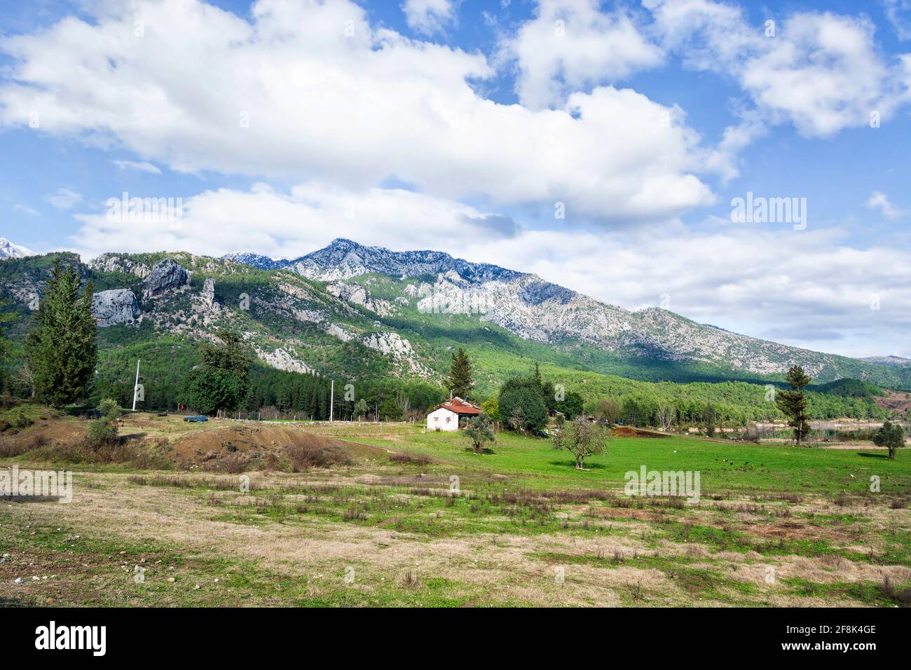 Farmland with the Taurus mountains in the background in Turkey Stock Photo