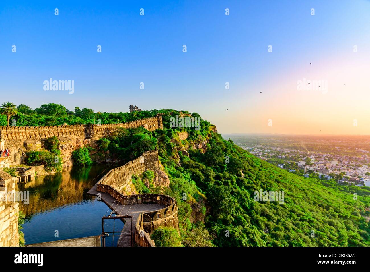 View during sunset from Chittor or Chittorgarh Fort with city in backdrop. It is one of the largest forts in India &  listed in the UNESCO World Herit Stock Photo