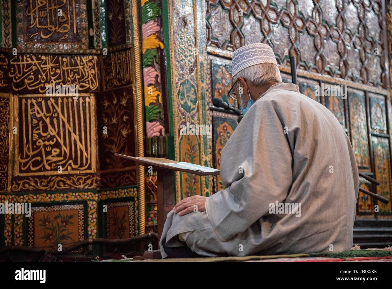 Srinagar, India. 14th Apr, 2021. A Kashmiri man reading the Islamic ...