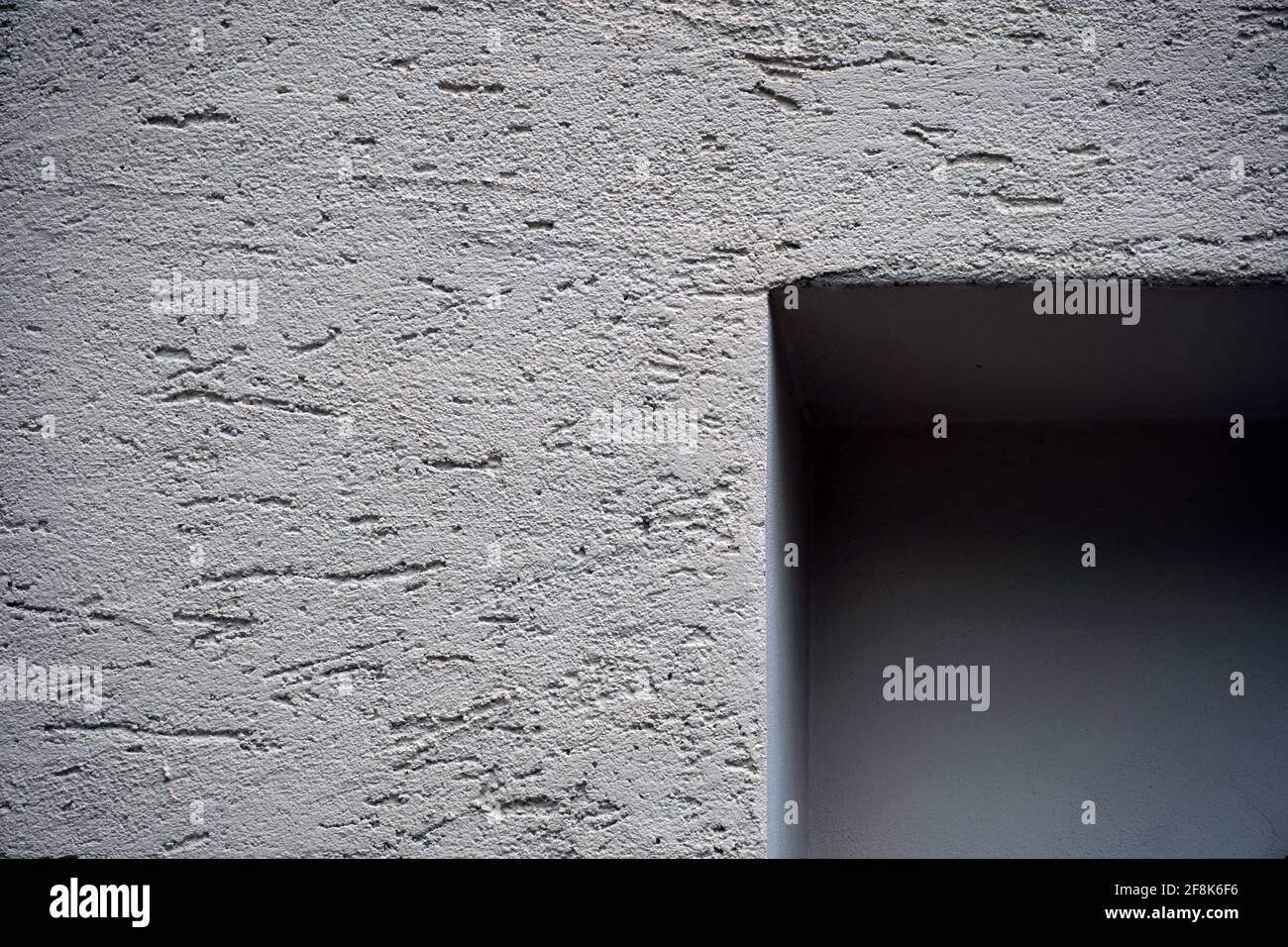 Concrete wall, lines and shapes in an architectural simple concept photograph, close-up, hand held, colour photography with a copy space. Stock Photo