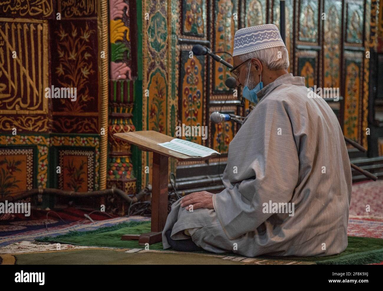 Srinagar, India. 14th Apr, 2021. An old Kashmiri man reads the Islamic ...
