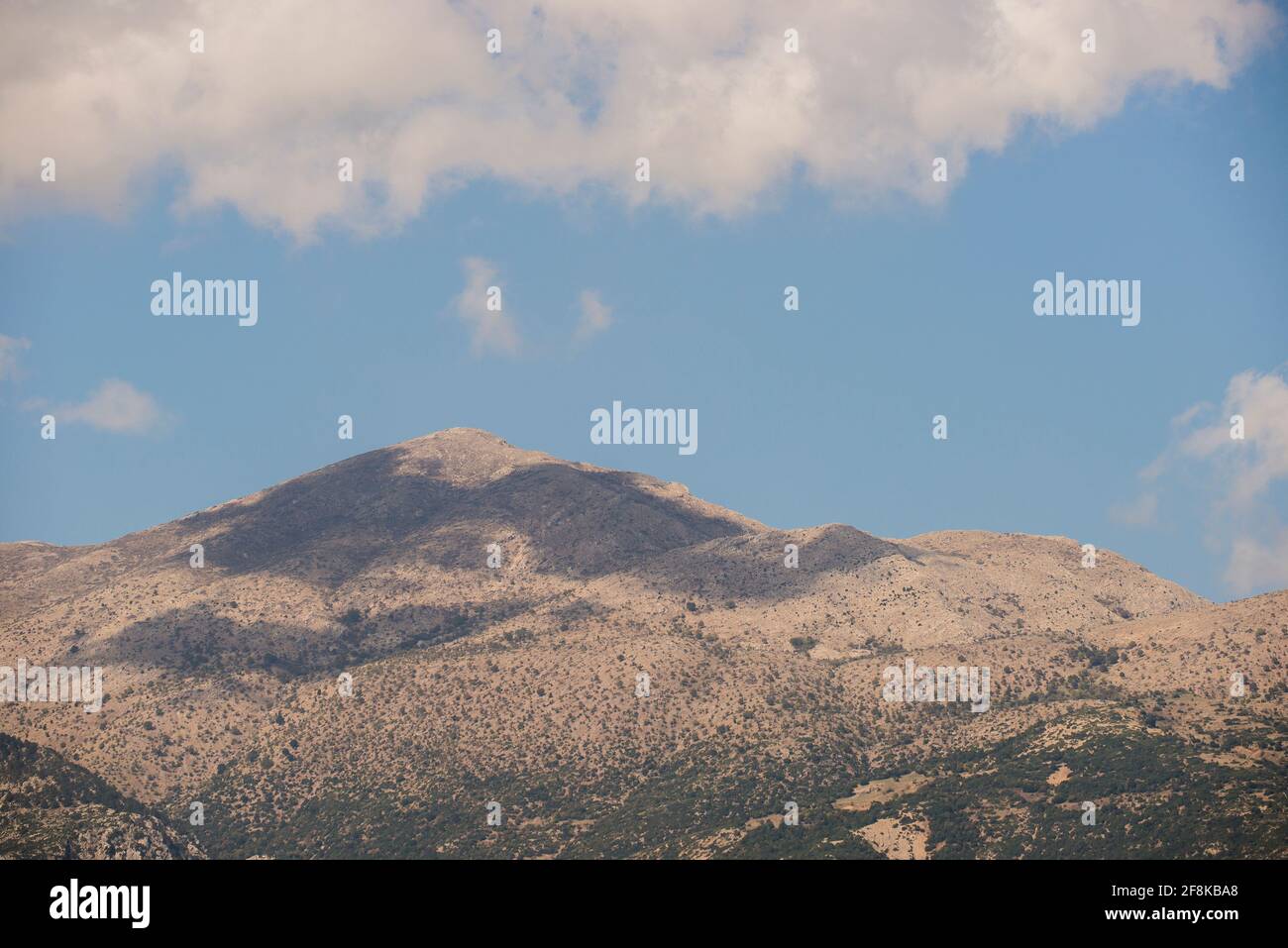 View on a typical mountain in Peloponnese, South-Greece, with a cloud above Stock Photo
