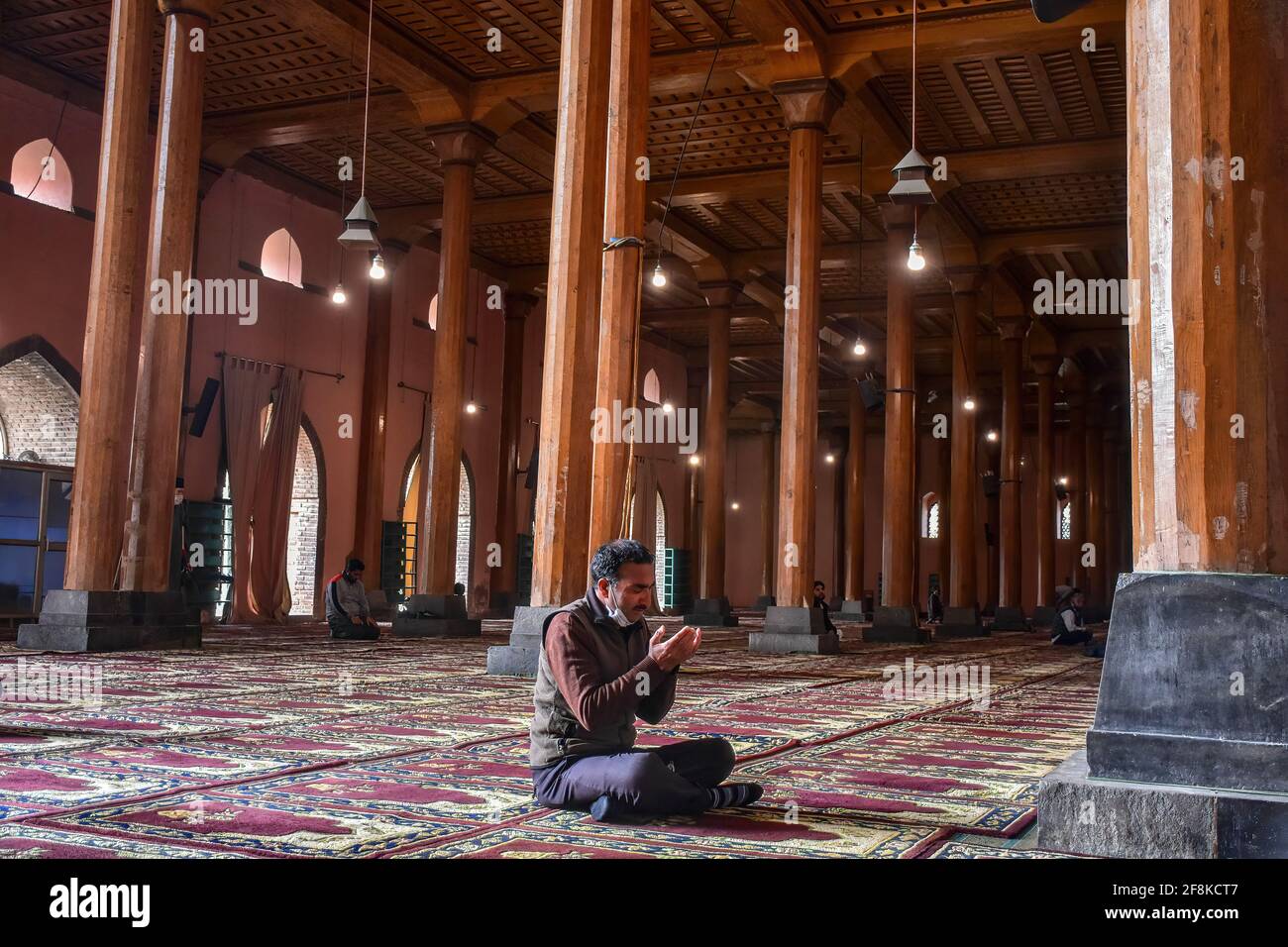 Srinagar, India. 14th Apr, 2021. A man prays inside the Jamia Masjid or ...