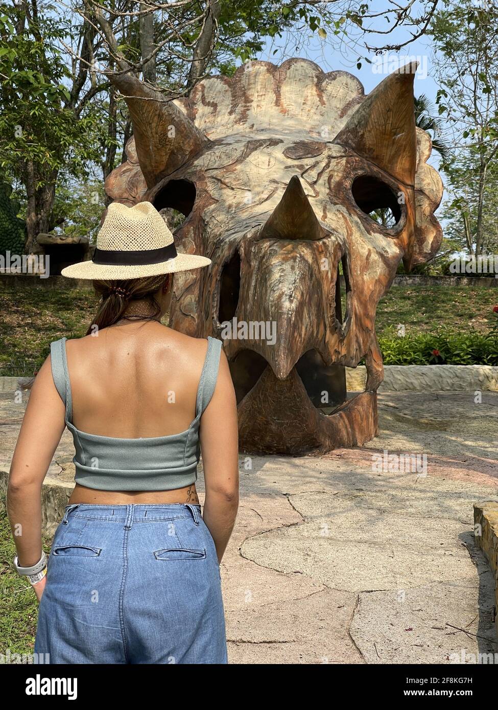 Vertical shot of a woman wearing a summer outfit at the zoo Stock Photo -  Alamy