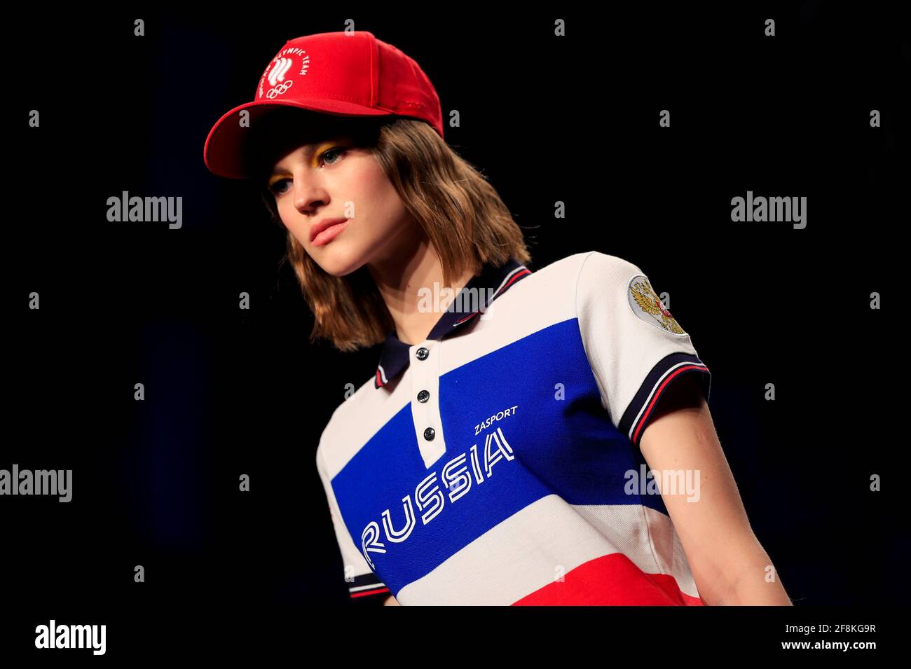 A model presents one of the uniforms of the Russian Olympic team designed  by ZASPORT, the official clothing supplier for national athletes competing  in this year's Tokyo Olympics, in Moscow, Russia April