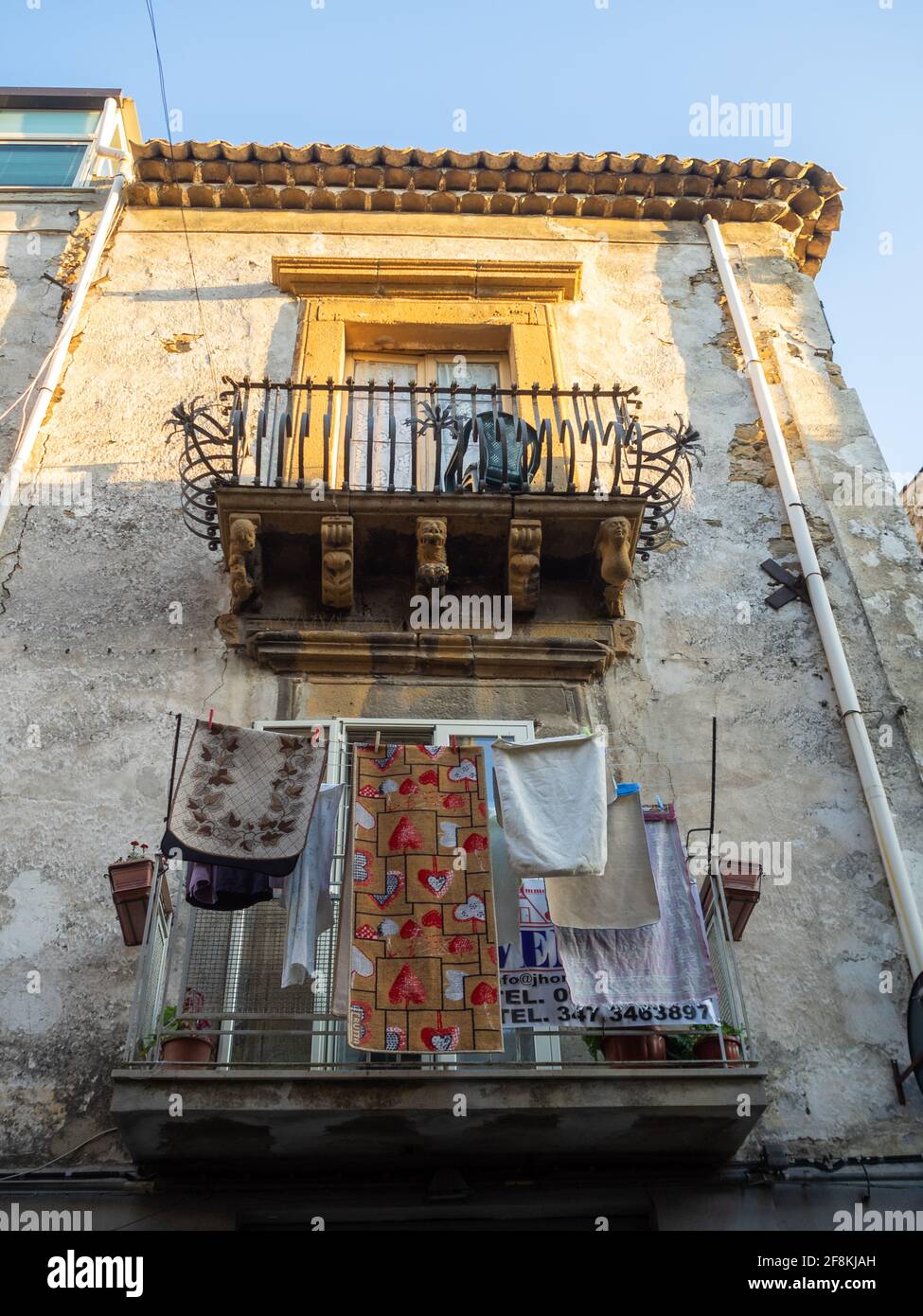 Drying clothes and baroque balconies Stock Photo
