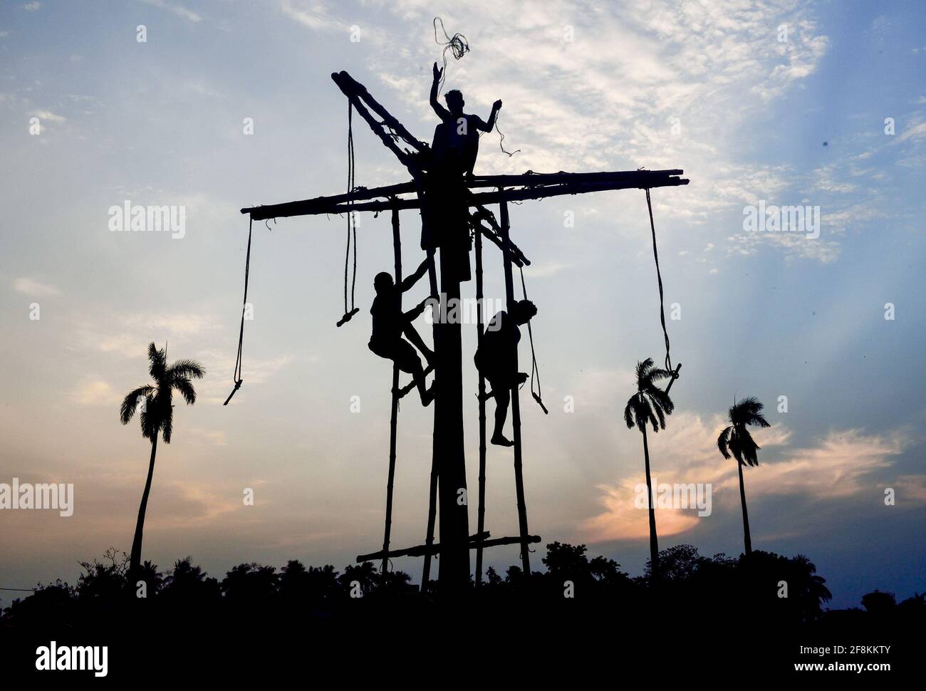 Kolkata, India. 14th Apr, 2021. People getting ready on the poles to