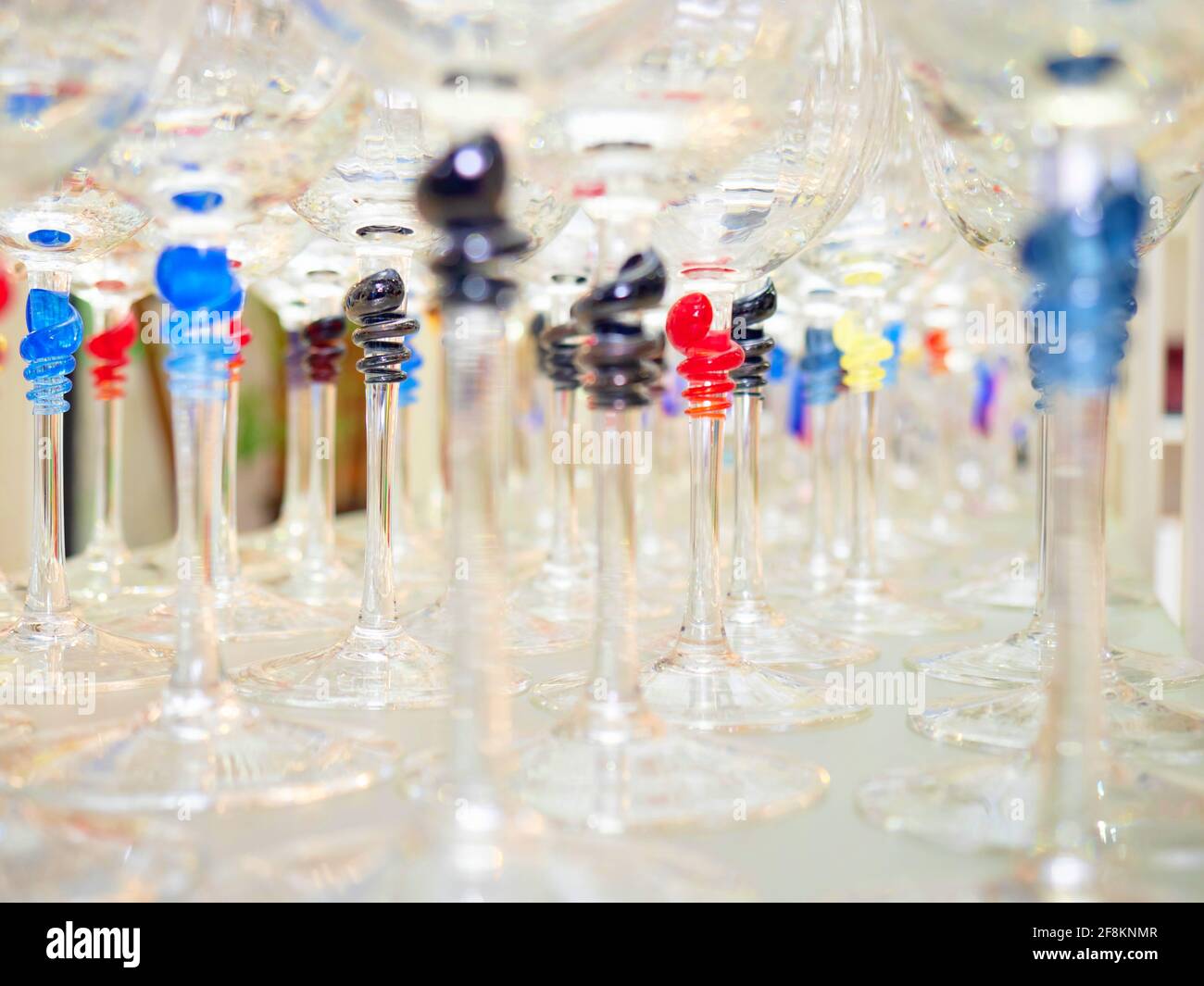 Crystal glasses for wine and champagne with a decorative colored stem