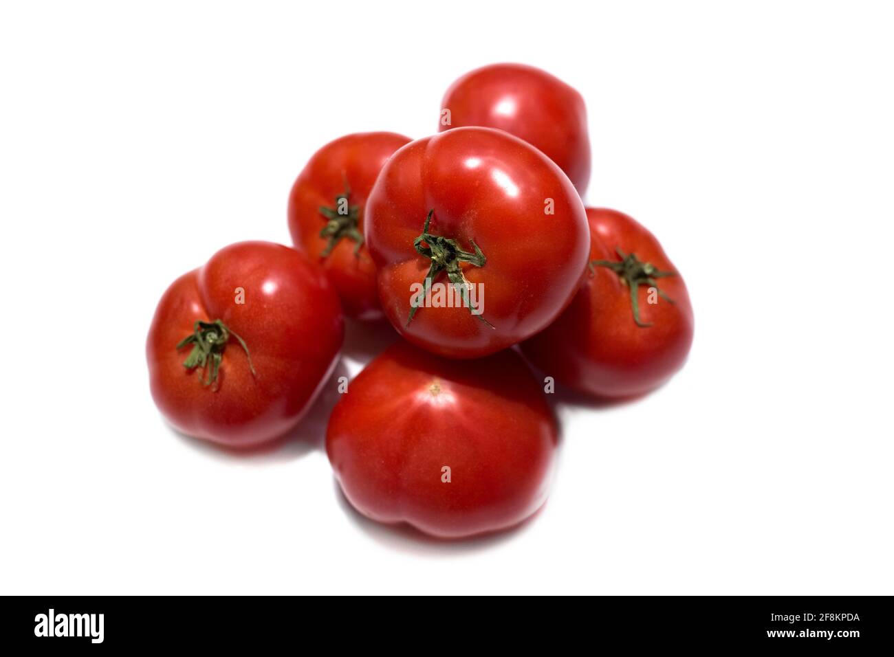 Red ripe tomatoes isolated on white background Stock Photo - Alamy