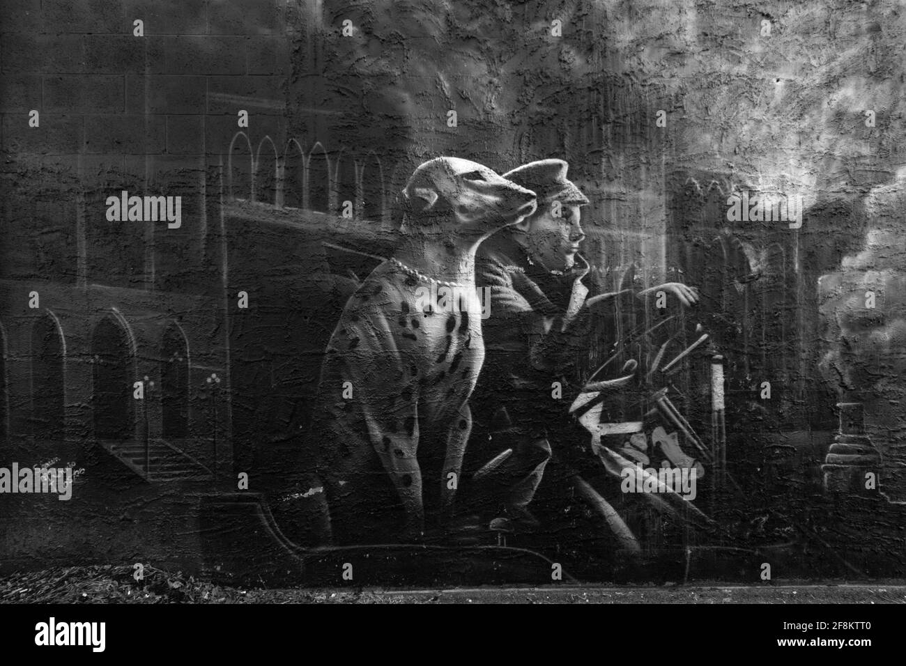 Ottawa Firefighters Mural. Black and white painting of old fashioned fireman and a Dalmatian dog. Stock Photo