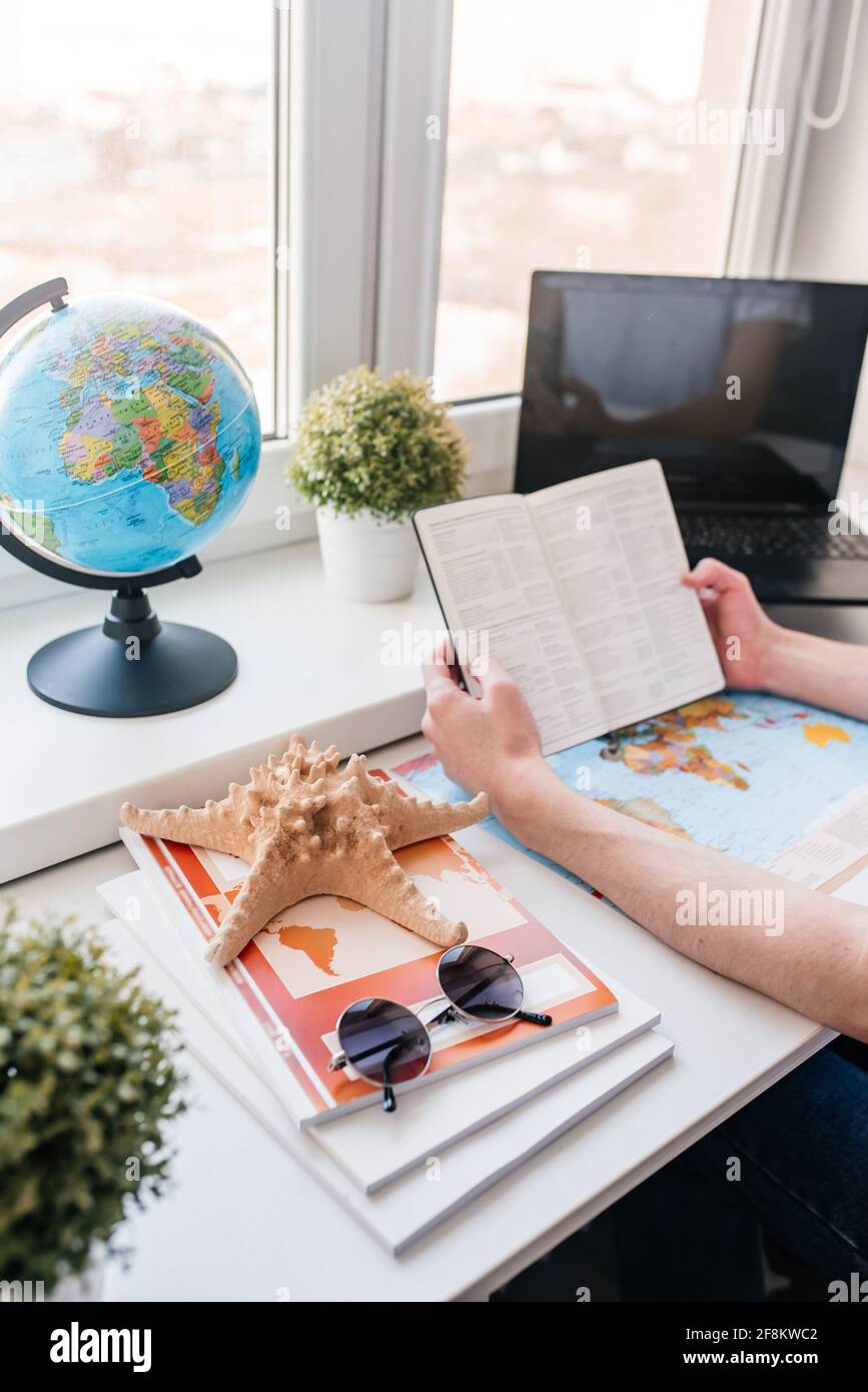 Planning a trip laptop map hi-res stock photography and images - Alamy