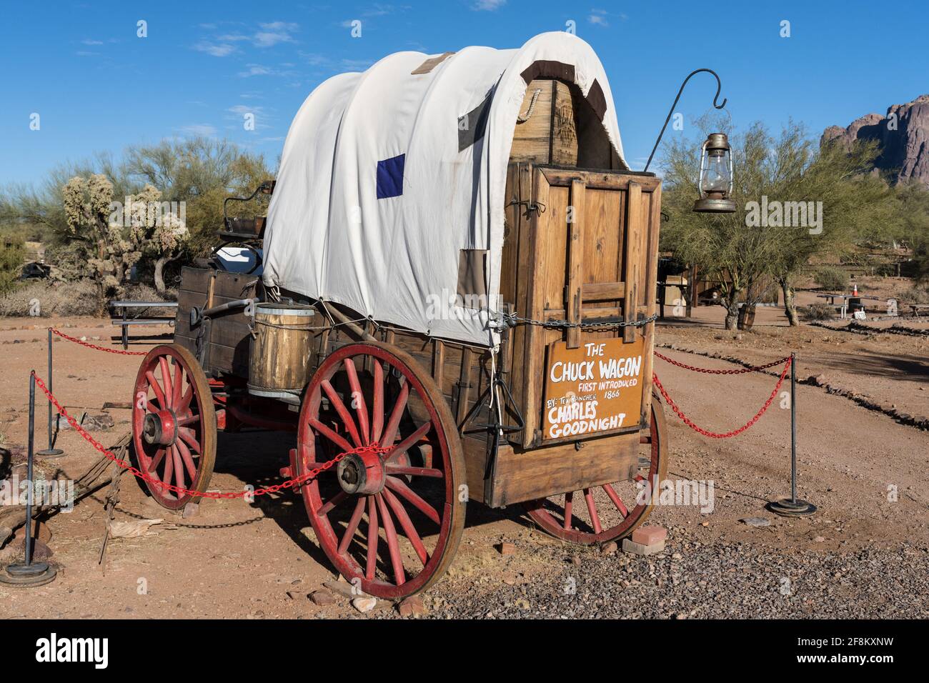 The cowboy chuck wagon was a mobile kitchen designed by cattleman Charles Goodnight to feed his cowboys on long cattle drives.  Superstition Mountain Stock Photo