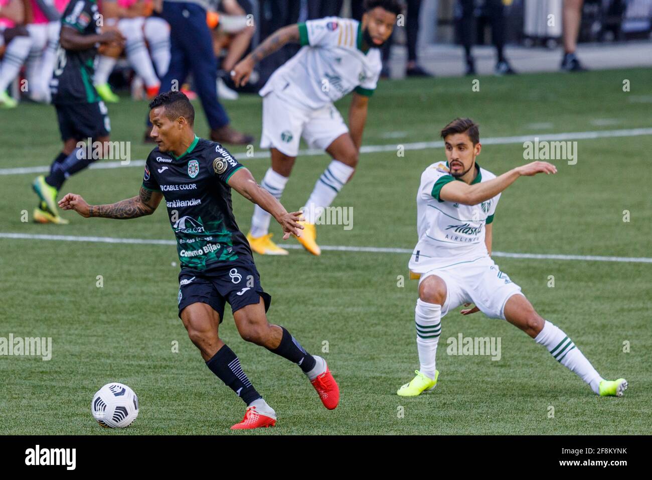 Portland, USA. 13th Apr, 2021. CD Marathon's Luis Garrido (8) steals the ball. The Portland Timbers trounced Honduras' CD Marathon 5-0 on April 13, 2021 in Portland, Oregon, including a hat trick by Yimmy Chara, in their second meeting in the CONCACAF round of 16. Their first meeting last week in Honduras was a 2-2 tie. (Photo by John Rudoff/Sipa USA) Credit: Sipa USA/Alamy Live News Stock Photo