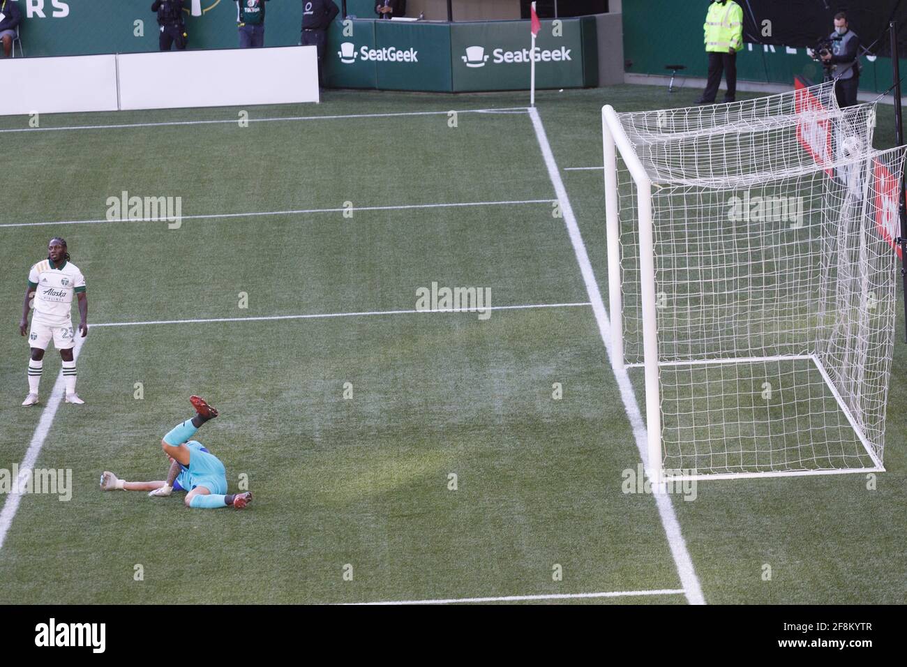 Portland, USA. 13th Apr, 2021. Yimmi Chara (23) gets a third goal past Marathon goalkeeper Denovan Torres. The Portland Timbers trounced Honduras' CD Marathon 5-0 on April 13, 2021 in Portland, Oregon, including a hat trick by Yimmy Chara, in their second meeting in the CONCACAF round of 16. Their first meeting last week in Honduras was a 2-2 tie. (Photo by John Rudoff/Sipa USA) Credit: Sipa USA/Alamy Live News Stock Photo