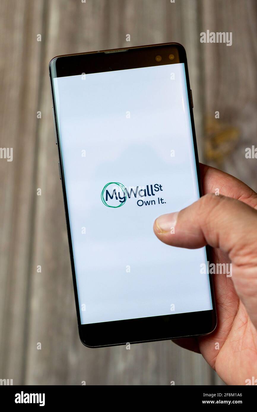 A Mobile phone or Cell phone being held in a hand showing the My Wall