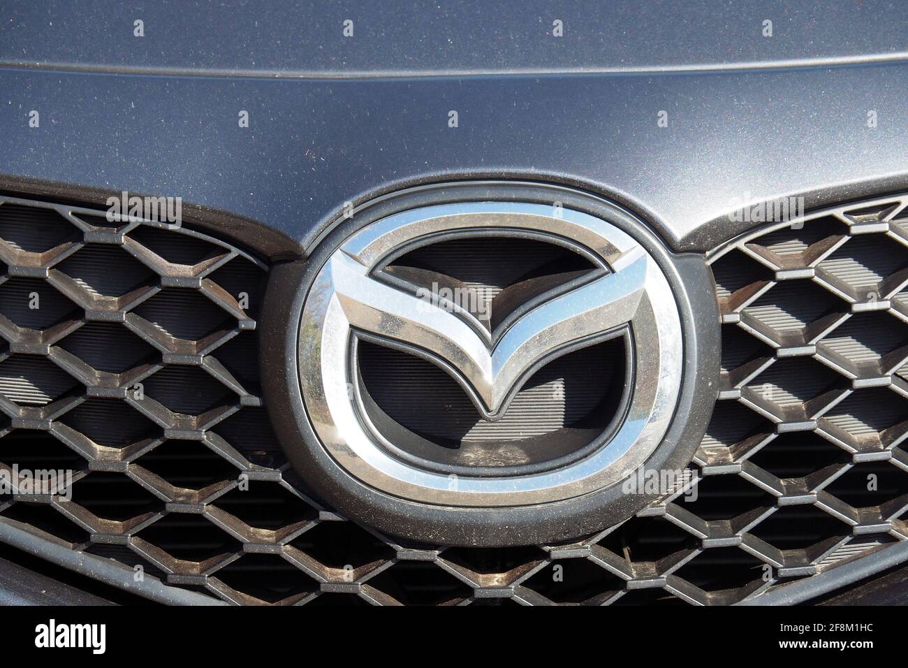 Mazda logo on a car Stock Photo Alamy