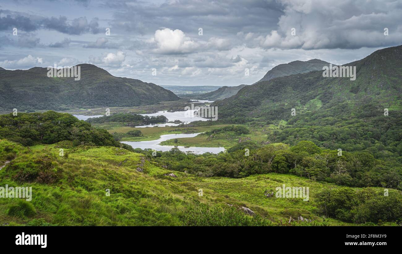 Irish iconic viewpoint, Ladies View, with multiple lakes, green valley, forest and mountains, Killarney, Rink of Kerry, Ireland Stock Photo