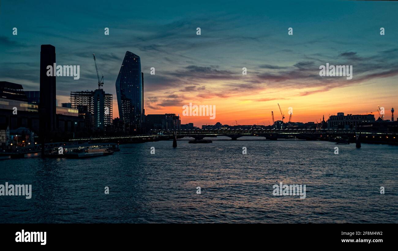 Sunset over The River Thames and The Millennium Bridge, London England - 04 April 2021 Stock Photo