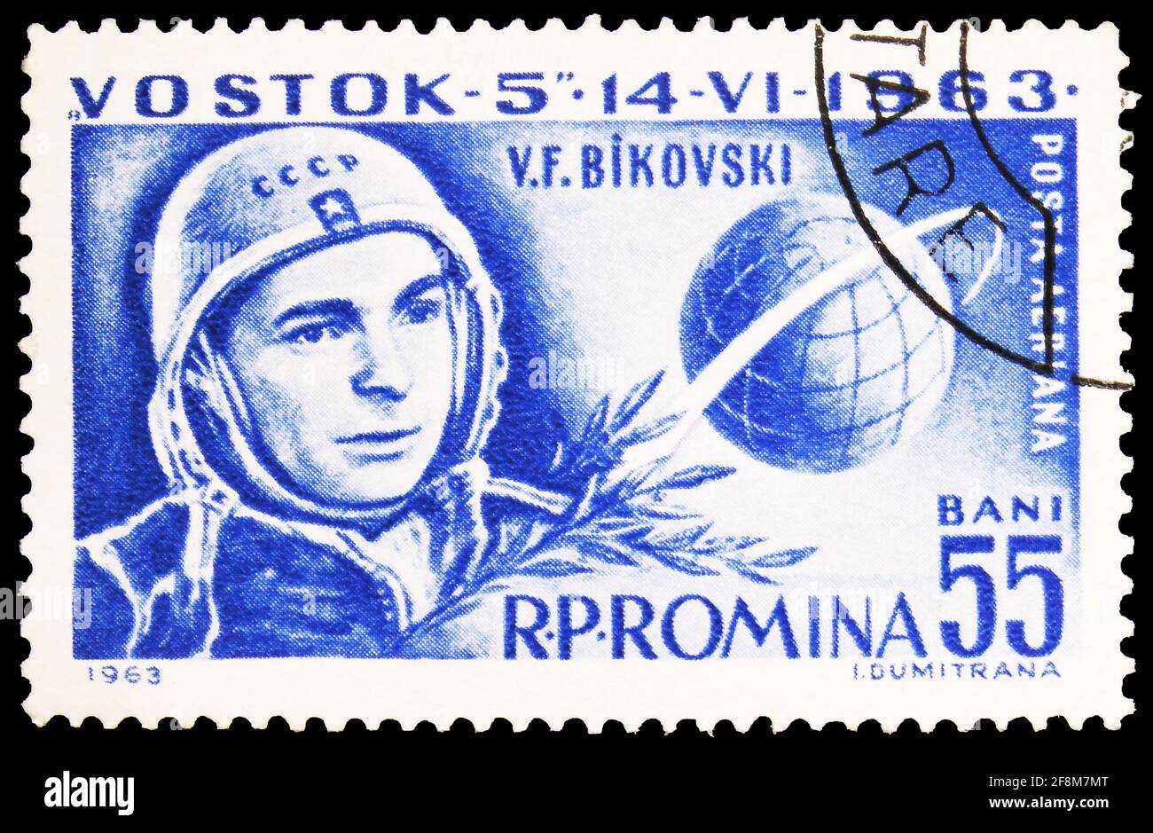 MOSCOW, RUSSIA - SEPTEMBER 30, 2019: Postage stamp printed in Romania shows Valeri Bykowski & Globe with orbit, Vostok 5 and 6 serie, circa 1963 Stock Photo