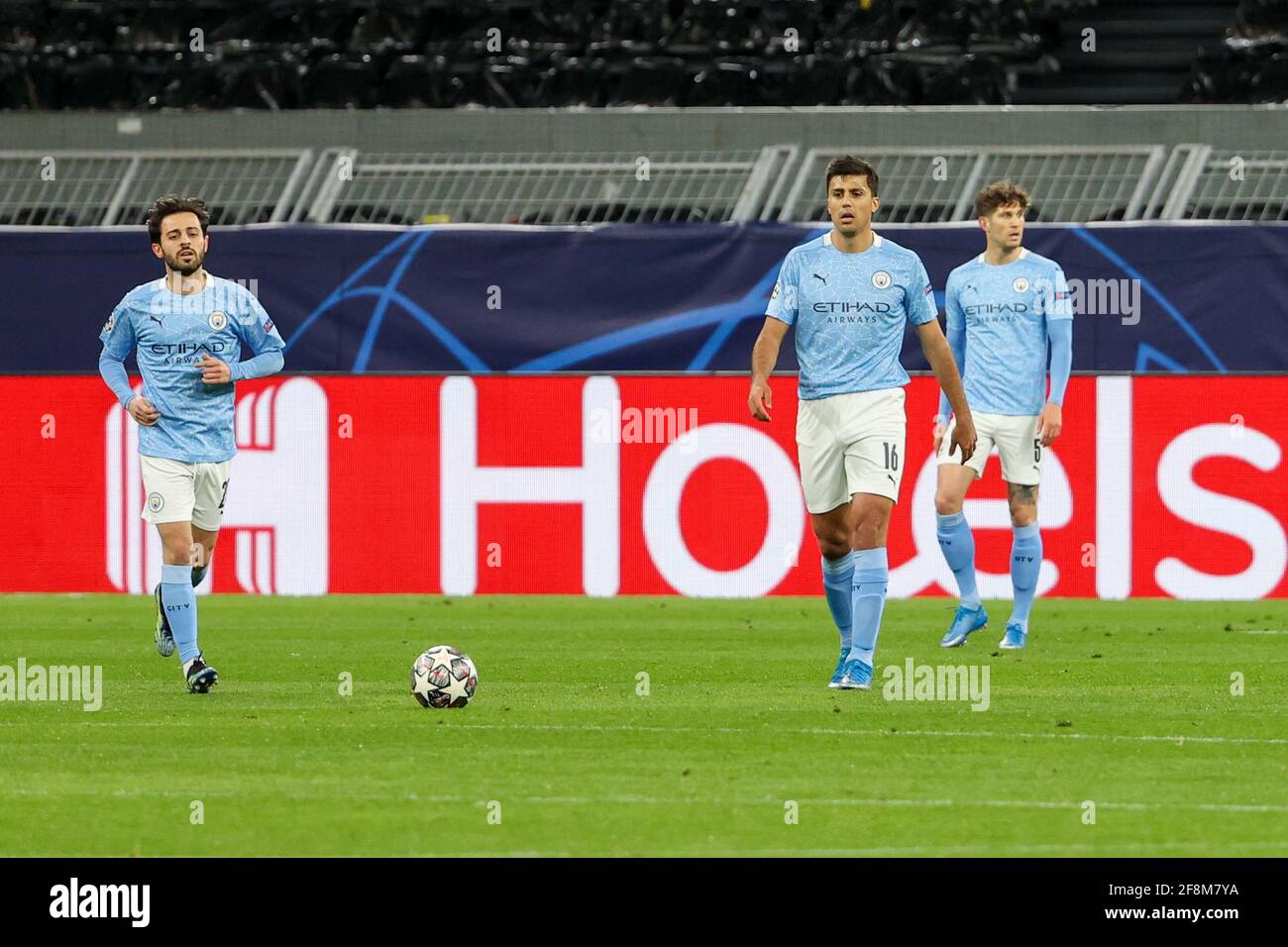 DORTMUND, GERMANY - APRIL 14: Bernardo Silva of Manchester City, Rodri of Manchester City and John Stones of Manchester City disappointed during the U Stock Photo