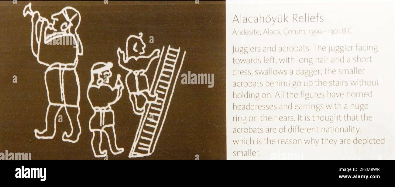 Ancient illustration of jugglers and acrobats with explanation text, Alacahoyuk reliefs, Turkey Stock Photo