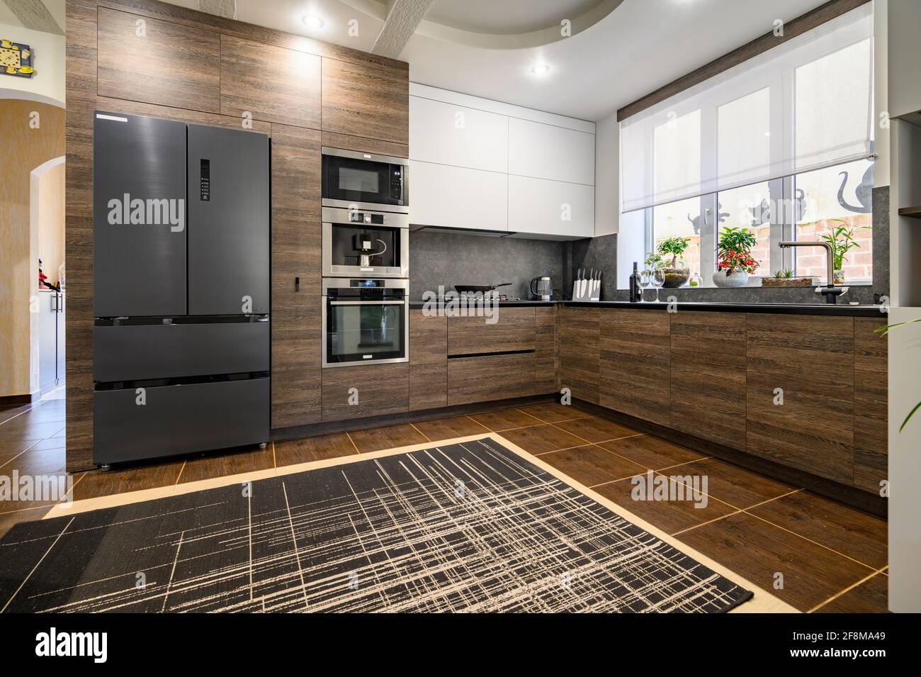 Modern luxurious dark brown, gray and black kitchen details Stock Photo