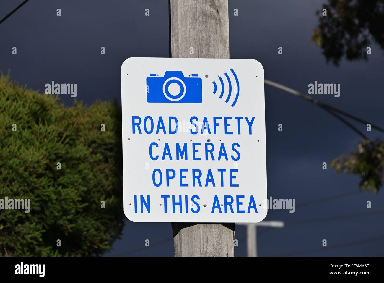 A Victorian Government road safety camera sign, indicating speed or red light cameras currently operate in the area Stock Photo