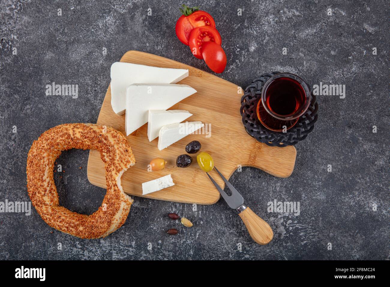 Turkish bagel (simit, gevrek) hot brewed Turkish tea and feta cheese ...