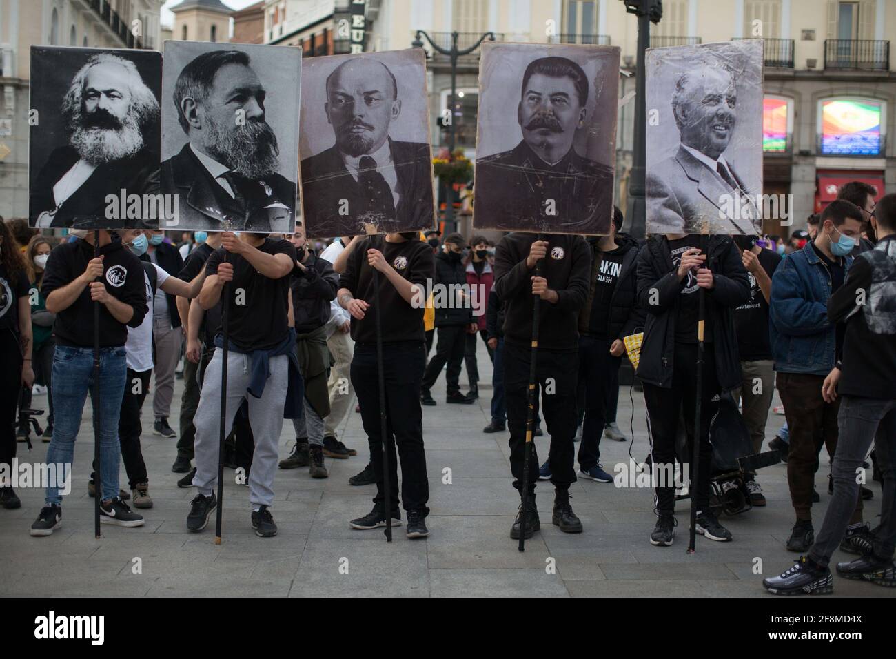 Young people holding portraits of (left to right) Marx, Engels, Lenin, Stalin and Hoxha during the second Spanish republic 90th anniversary march. The second Spanish republic was proclaimed on April 14, 1931 and was interrupted in 1936 by a coup, which led to three years of Civil War. In 1939, with the victory of the nationalist side, the Franco dictatorship was installed, in force for 36 years. Stock Photo