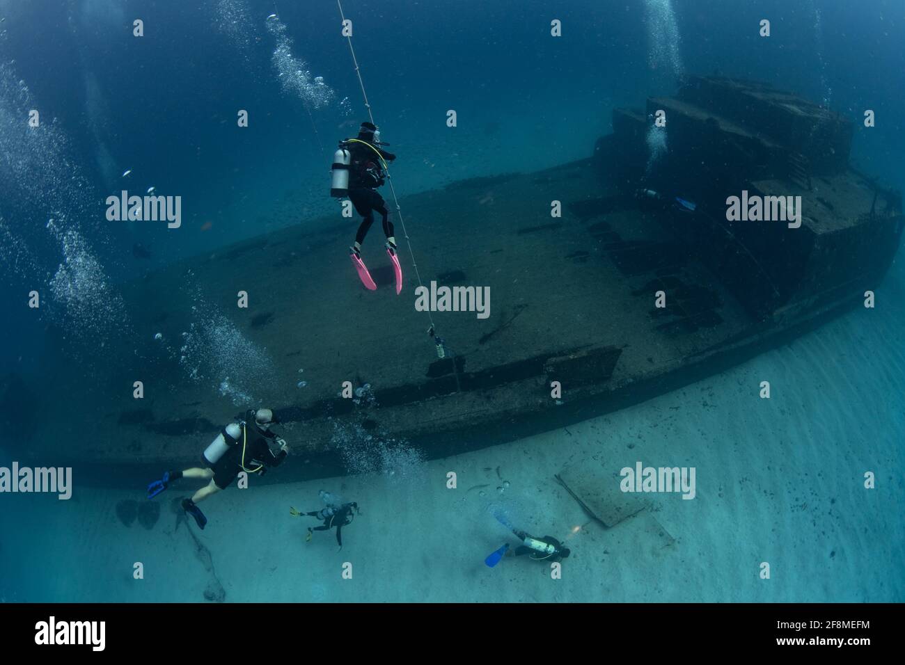 Divers on the wreck of the Carib Cargo off the island of Sint Maarten Stock Photo