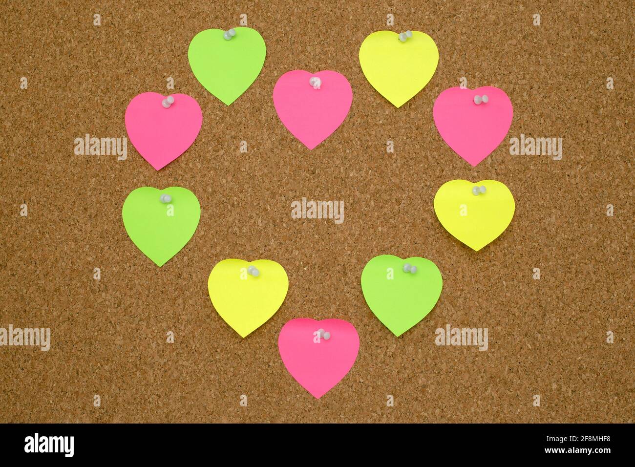 Paper heart shape sticky notes on cork board Stock Photo Alamy